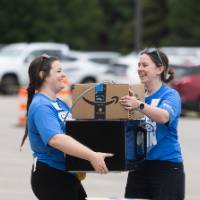 Two volunteers working together